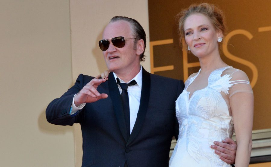 Quentin Tarantino and Uma Thurman pose together for the press.