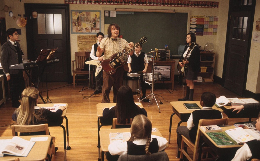 Jack black gives his students a rock lesson in class. 