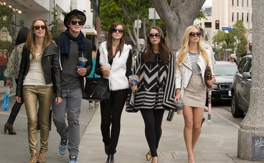 The cast of The Bling Ring walk down the street 