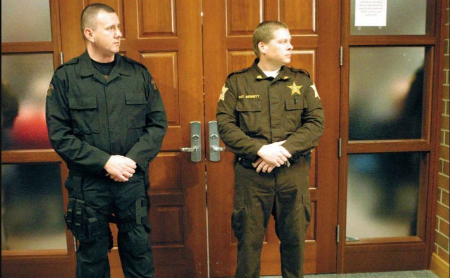Two Warrick County deputies guard the courtroom. 