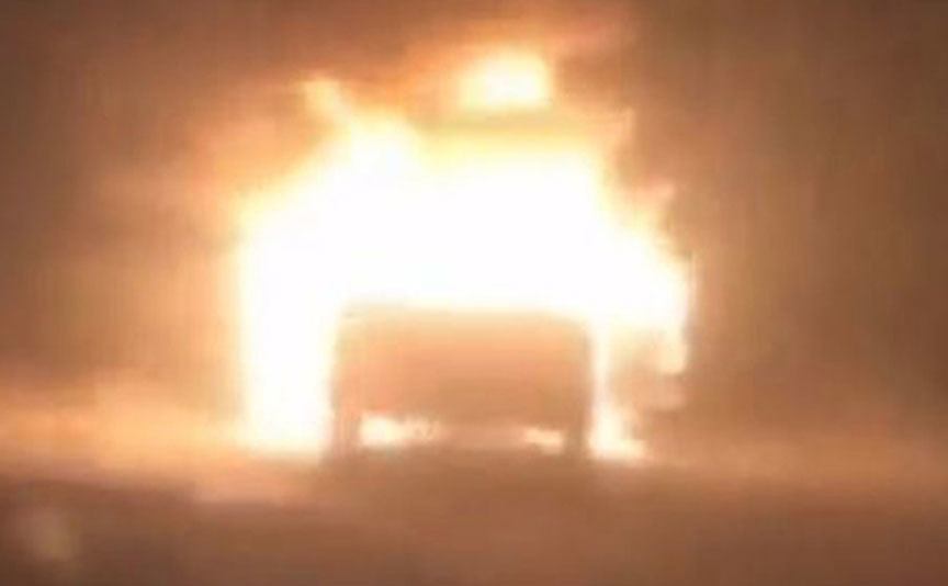 An image of a car set on fire.