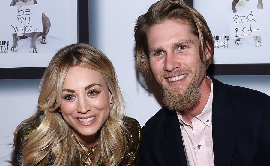 Kaley Cuoco and Karl Cook smile at an event. 