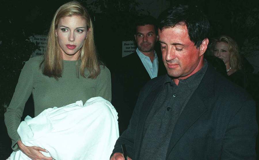 A photo of Stallone, Flavin and their baby daughter at a restaurant.