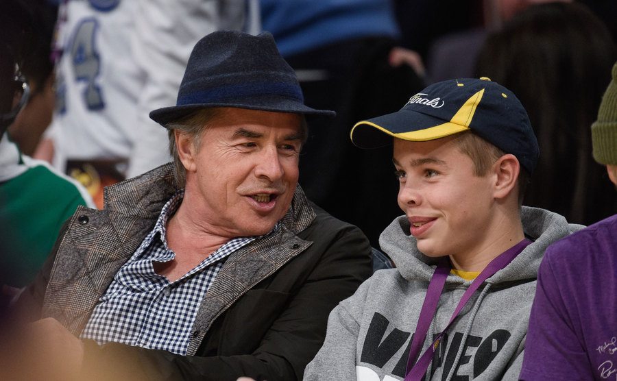 Don Johnson and his son Jasper Johnson attend a basketball game.