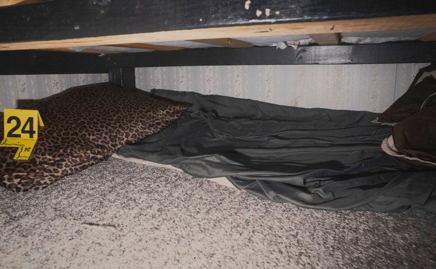 An evidence photo of the space under Jake Patterson's bed.
