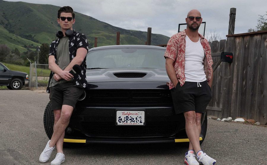 A picture of Ollie and Simon Ward driving their black Dodge through California.