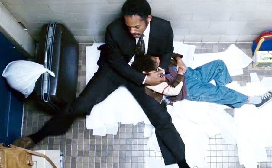 A movie still of Will Smith and Jaden Smith at the restroom scene.
