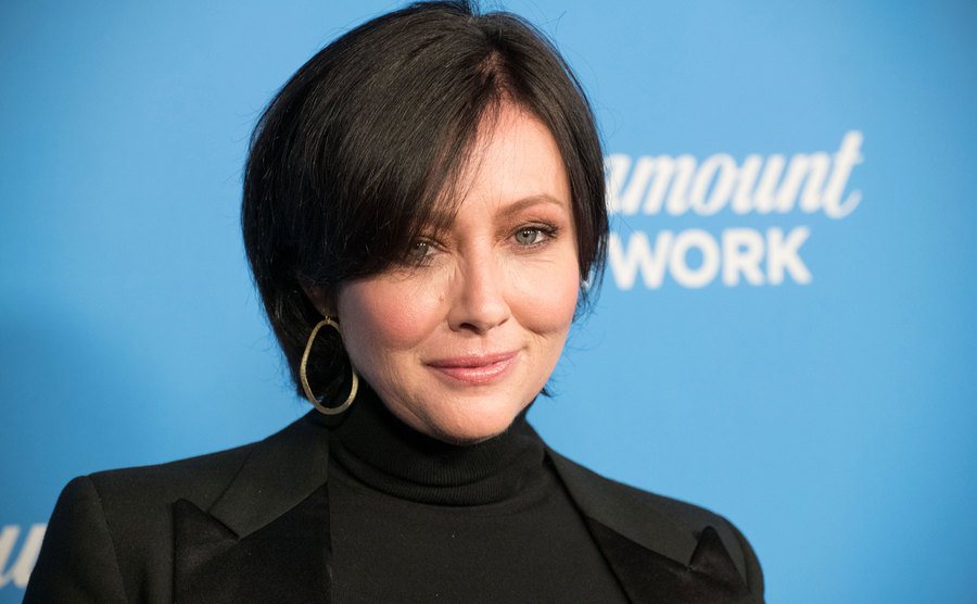 Shannen Doherty poses for the press.