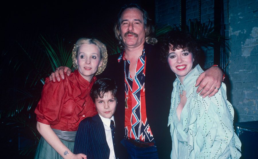 Mackenzie poses with John Phillips, her half-brother, and John's wife, Genevieve Waite.