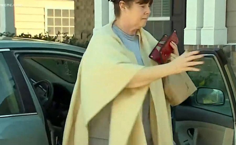An image of Cathy Wood arriving at home.