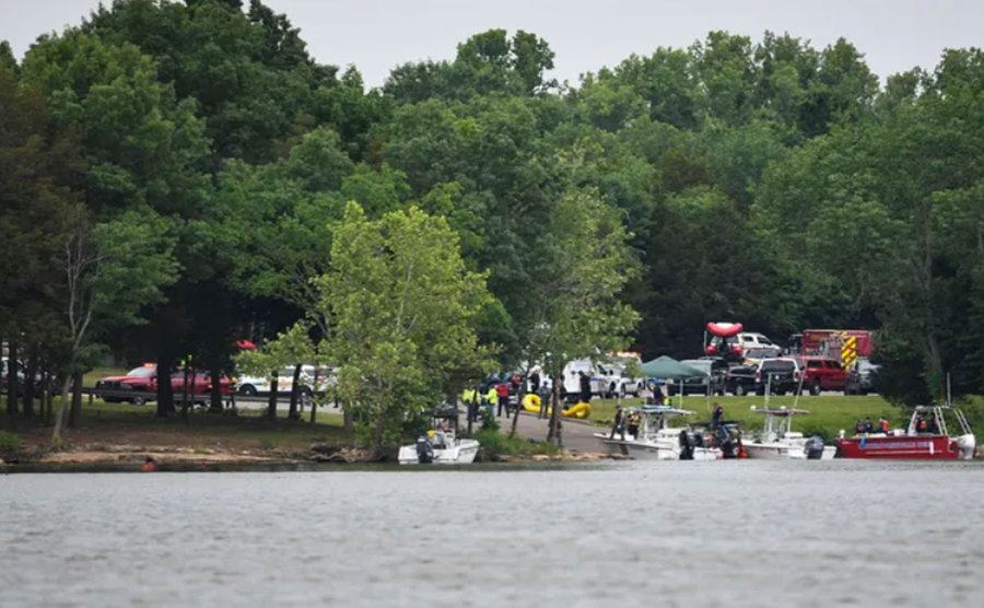 Emergency personal stage search for plane remains at a lake.