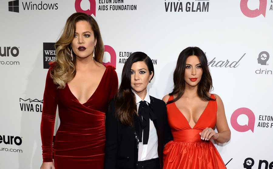 Khloe Kardashian, Kourtney Kardashian, and Kim Kardashian arrive at Elton John’s Oscar Viewing Party