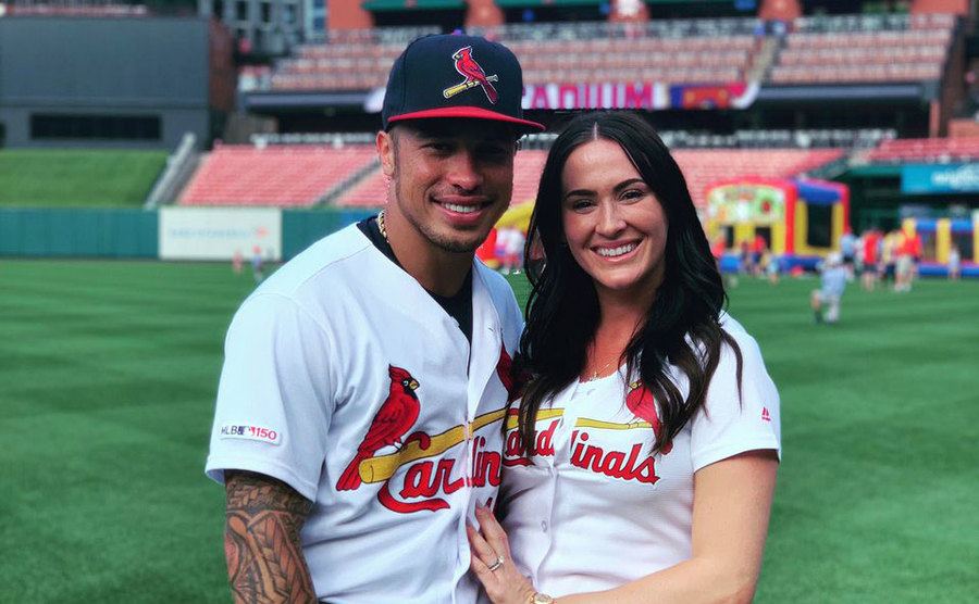 Kolten and Alissa Wong pose on the field. 