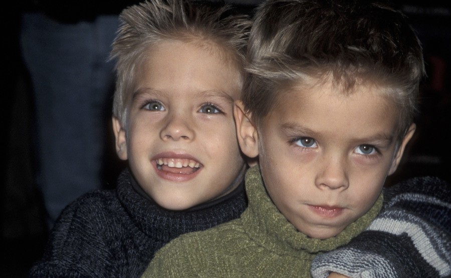 A dated picture of Dylan and Cole Sprouse attending an event.