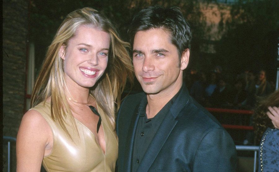 A photo of Romijn and Stamos attending an event.