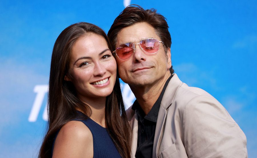 A photo of McHugh and Stamos attending an event.