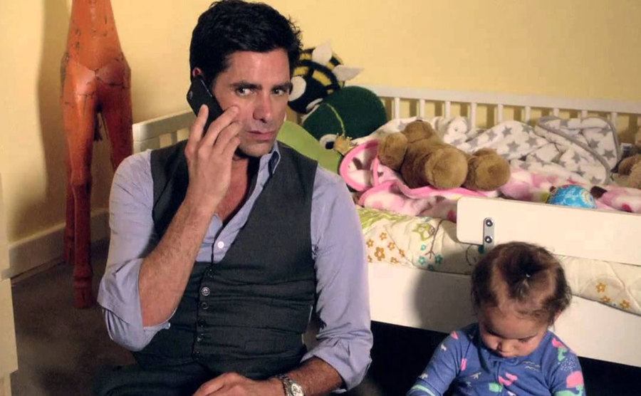 A still of John Stamos in a scene from the show.
