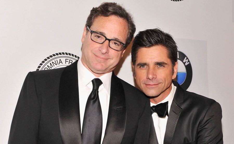 A picture of Saget and Stamos attending an event.