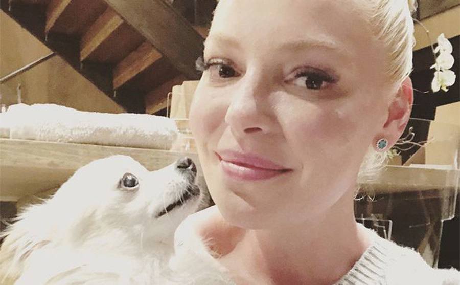 Katherine Heigl takes a picture with one of her dogs.