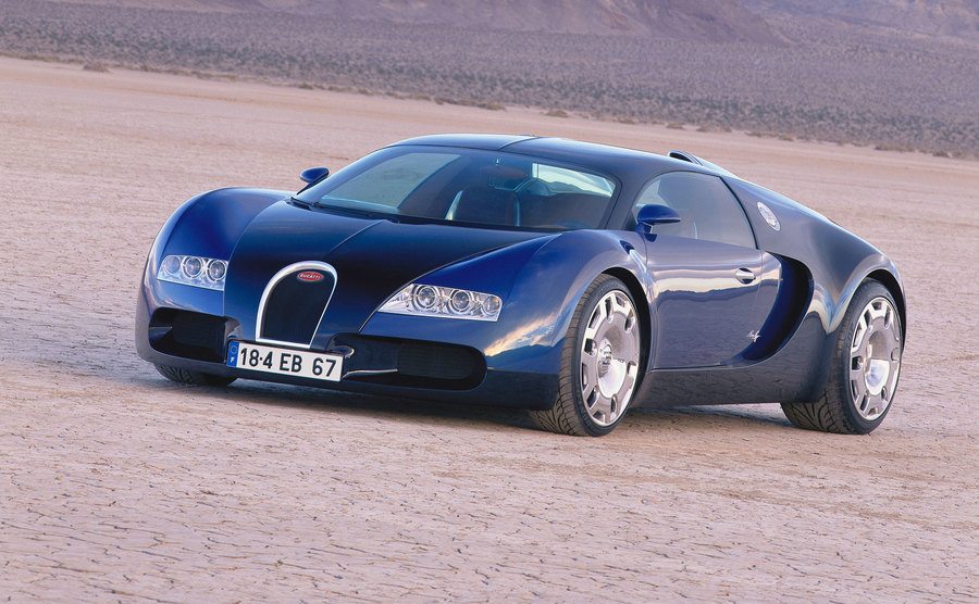 A Bugatti Veyron drives through the desert. 