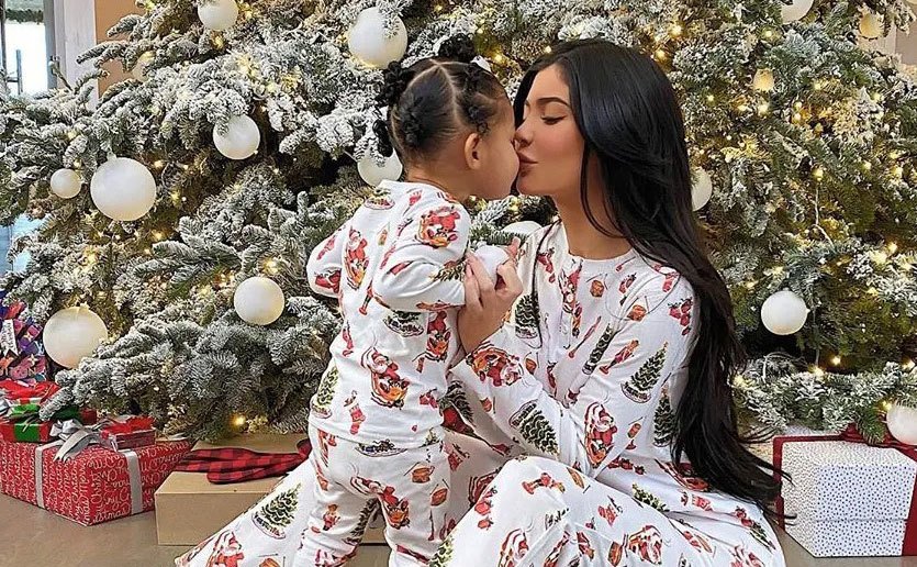 Kylie and Stormi pose for a Christmas photo. 