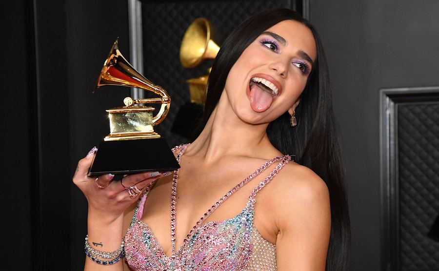 Dua Lipa, winner of Best Pop Vocal Album for ‘Future Nostalgia’, poses with her Grammy. 
