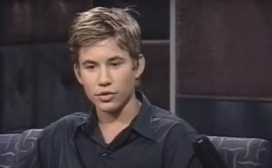 A dated video still of Jonathan during an interview.