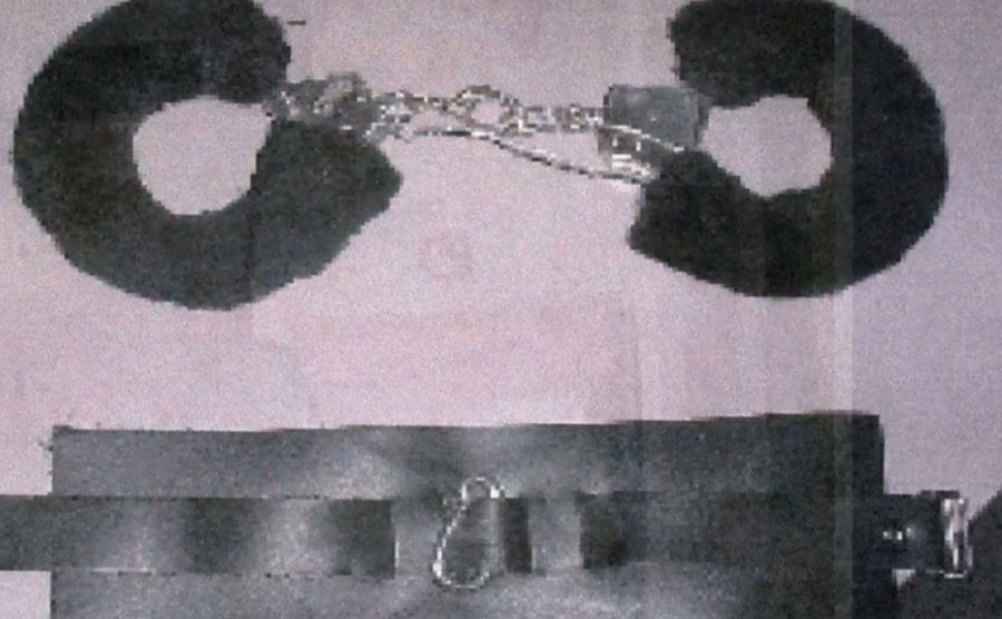 An image of the killer's handcuffs and leg restraint used with Kara.