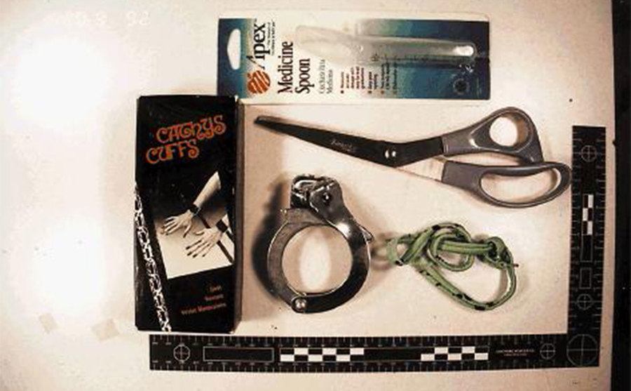 A picture of scissors and handcuffs.