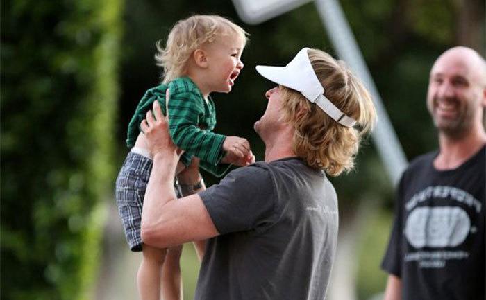 Owen Wilson holds his son Finn. 