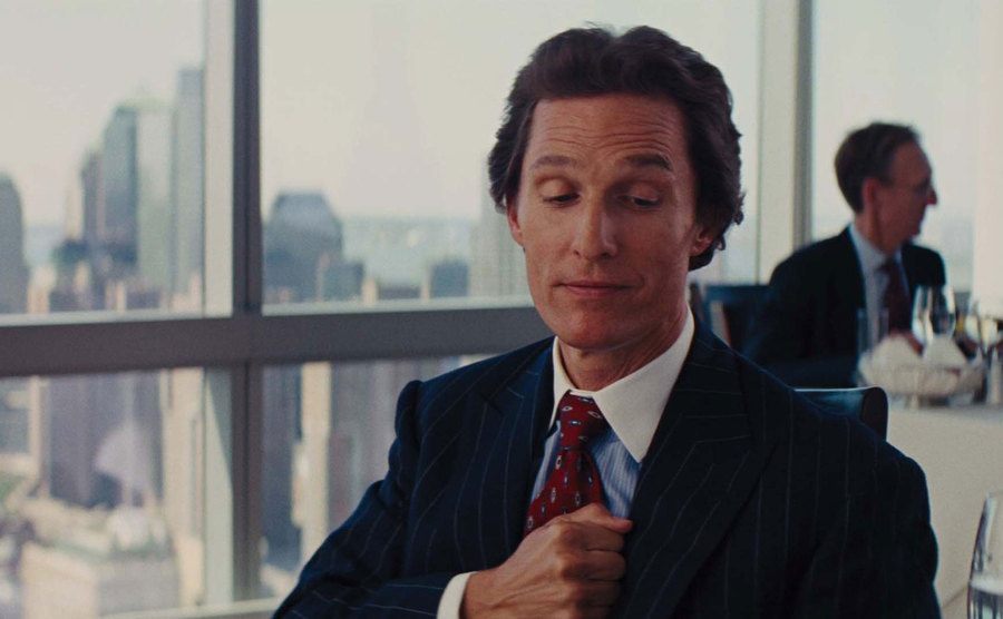 Matthew McConaughey is thumping his chest in a still from The Wolf of Wall Street. 