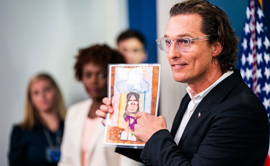 Matthew McConaughey shows victims artwork as he speaks at the White House press briefing. 