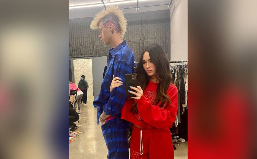 A mirror selfie of MGK and Megan backstage. 