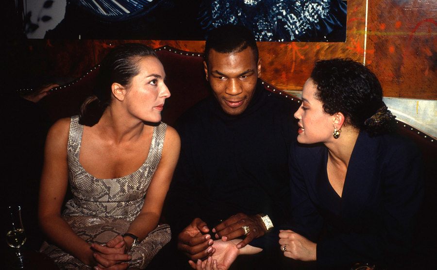 A picture of Tyson and female guests during a party.