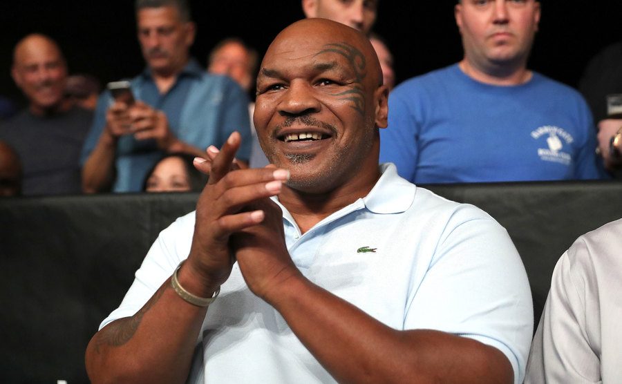 Tyson claps at the Boxing Hall of Fame event.