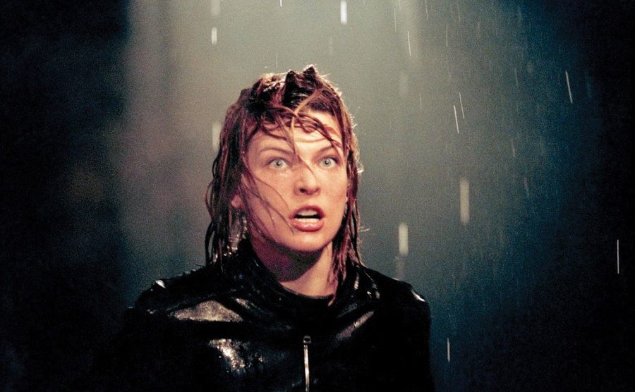 A still of Jovovich during an action scene in Resident Evil.