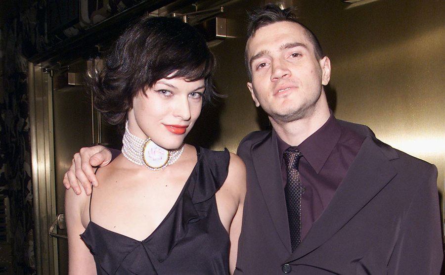 Jovovich and Frusciante attend an event. 