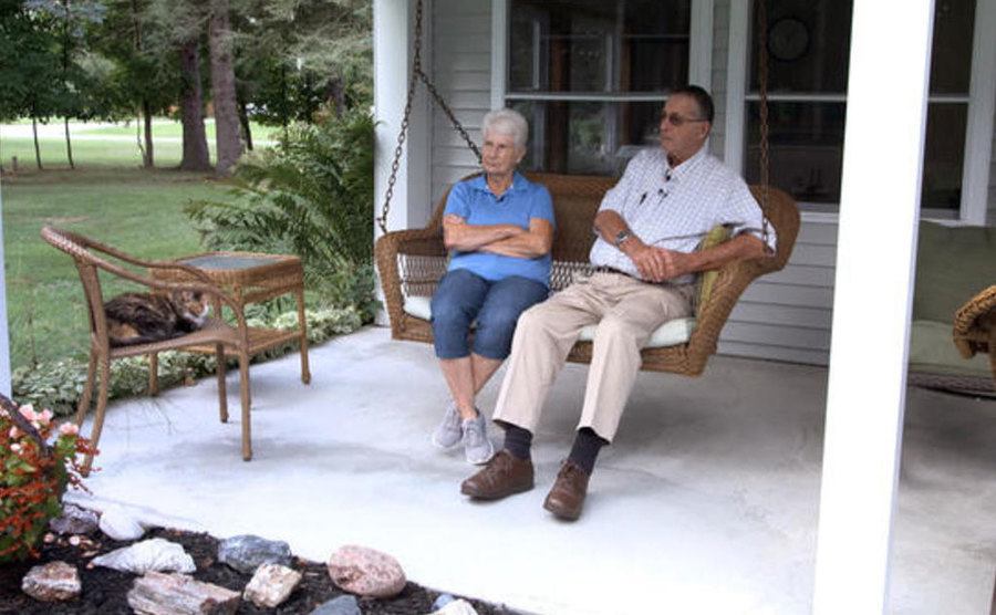 Jerry and Marge relax on their porch. 