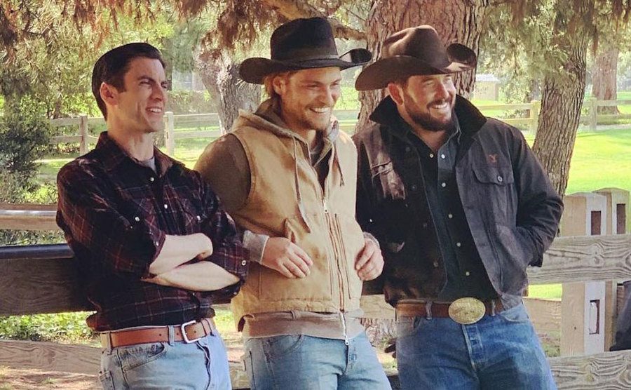 Actors from Yellowstone share a laugh on set. 