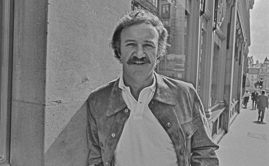 A dated portrait of Hackman walking the street.