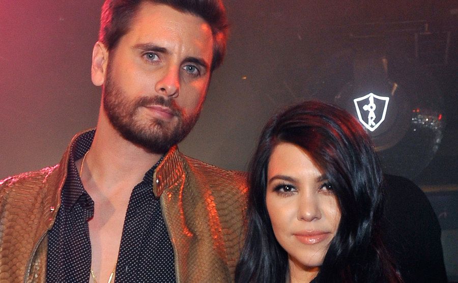 A photo of Scott Disick and Kourtney during an event.