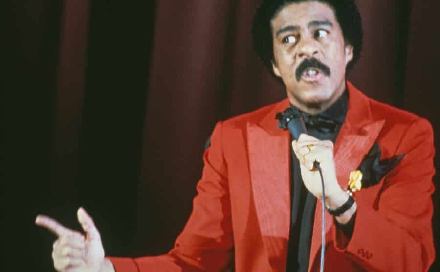 An image of Richard Pryor during a stage show.
