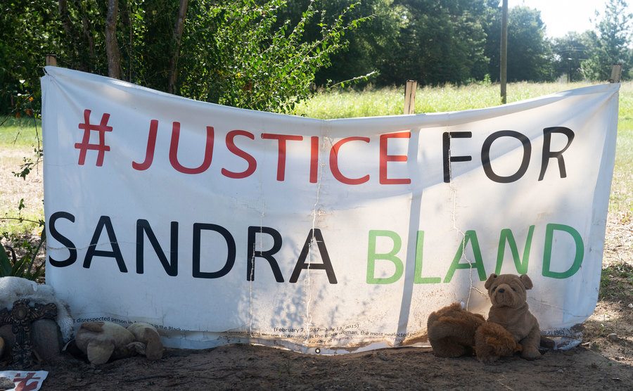 A photo of a memorial to Sandra reads Justice to Sandra Bland.