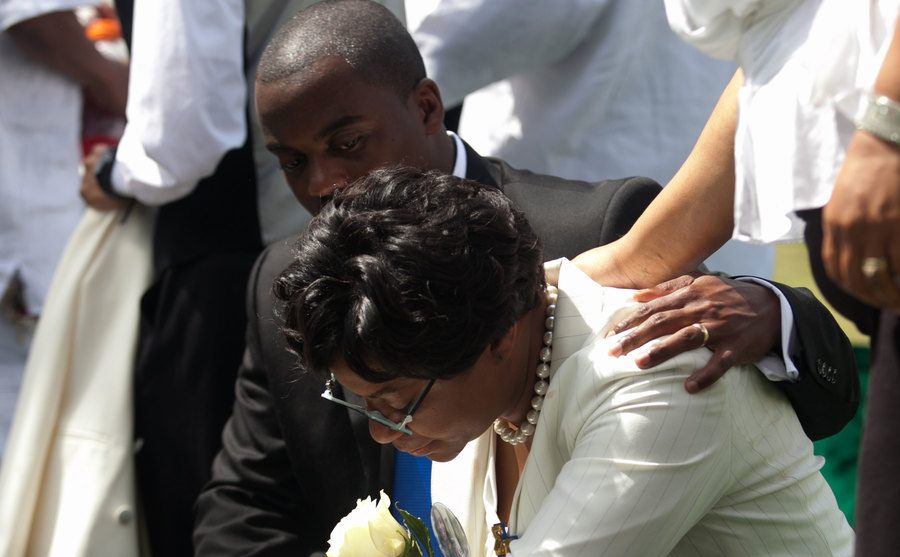 A mourner grieves at Bland’s funeral.