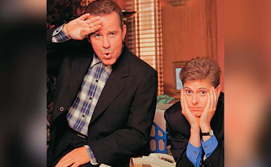 Phil Hartman and Davy Foley pose together on set. 