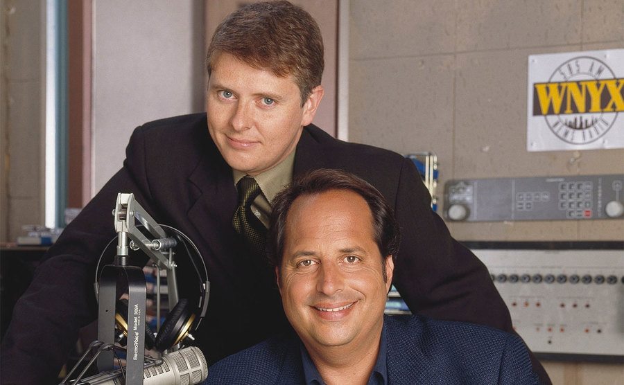 Dave Foley and Jon Lovitz pose on the set of NewsRadio. 
