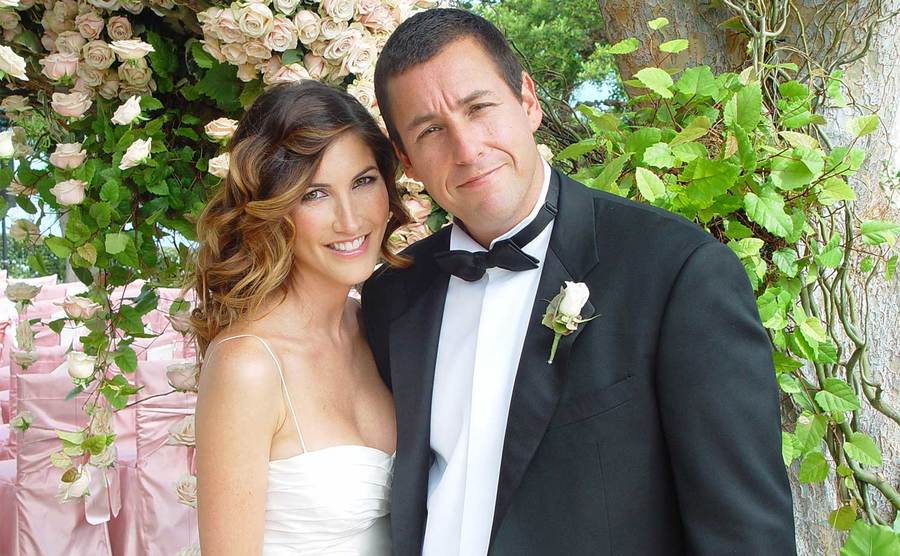 Adam Sandler poses with Jackie Titone at their wedding. 