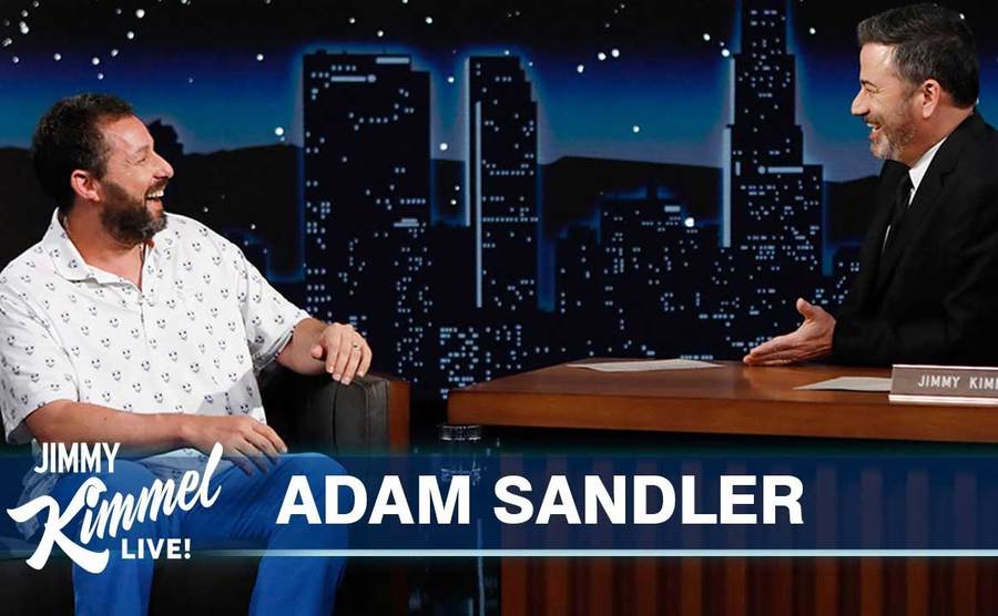 Adam Sandler has a laugh with Jimmy Kimmel on set. 