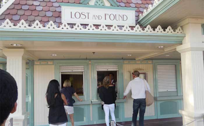 People stand outside the lost and found at Disneyland. 