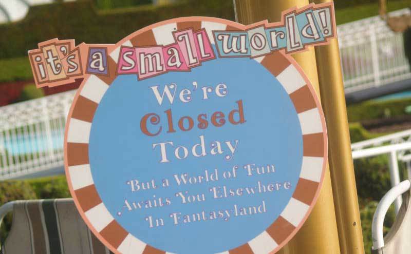 A sign explaining that the It’s a Small World ride is closed. 